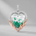 Dije Corazón de Esmeraldas Flotantes en oro 18k